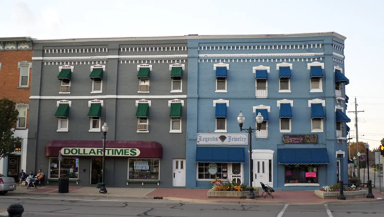 A colorful historic hotel building with awnings