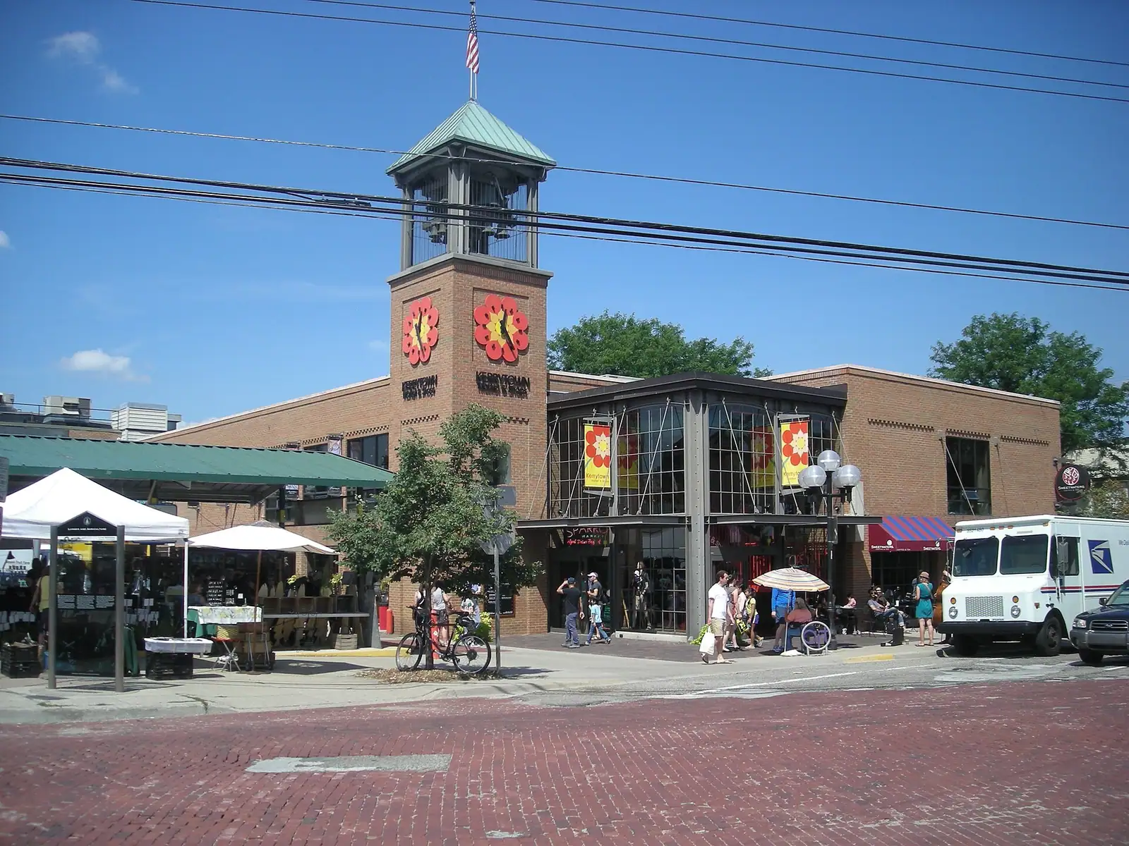 A historic brick market building with a clock tower