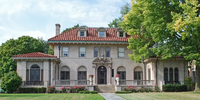 A Mediterranean-style historic home with a tile roof