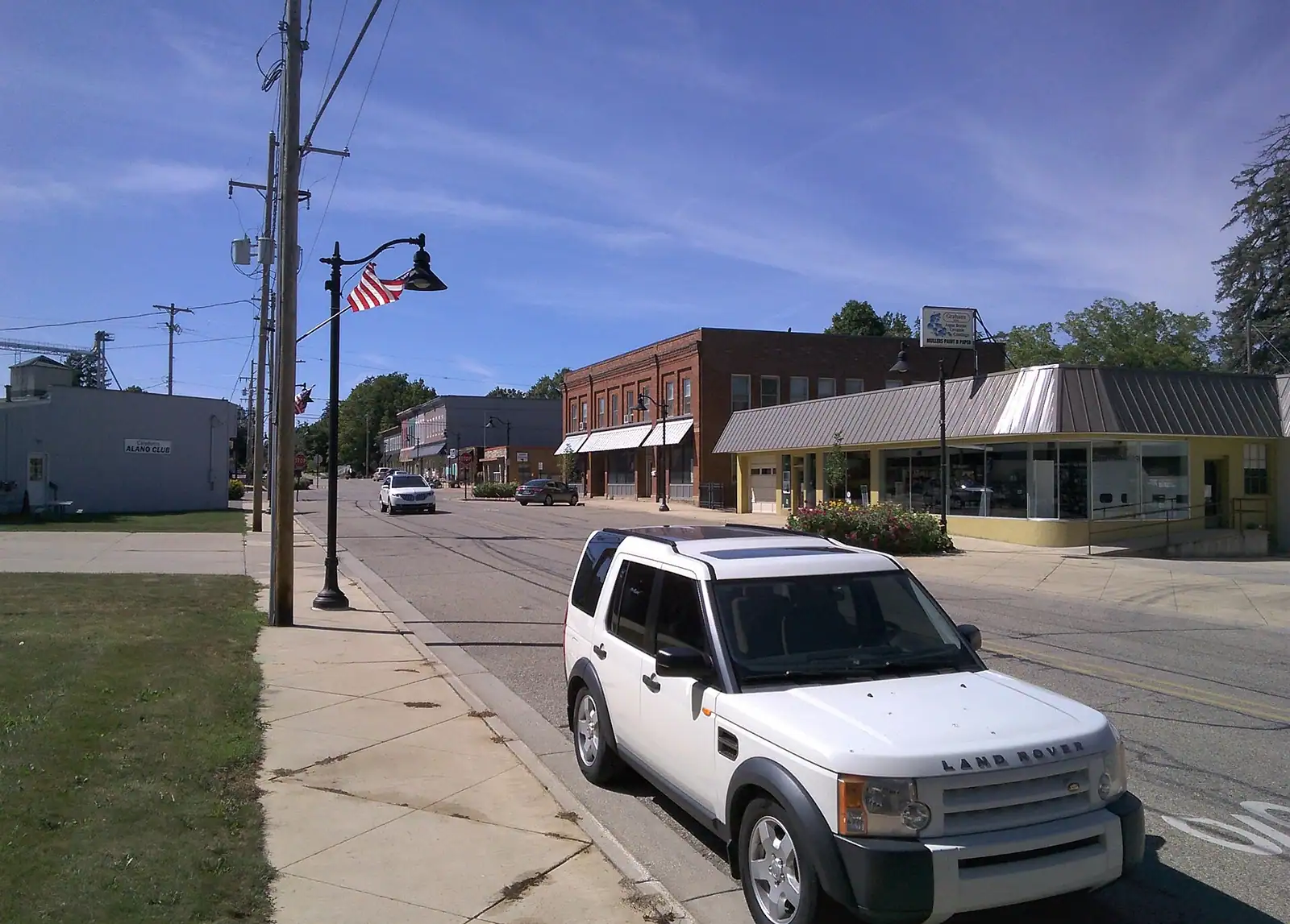 A small-town main street with brick storefronts