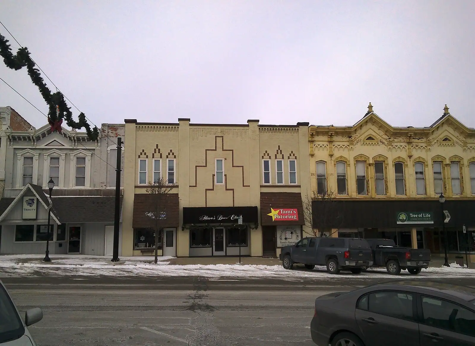 A row of historic storefronts on a downtown street