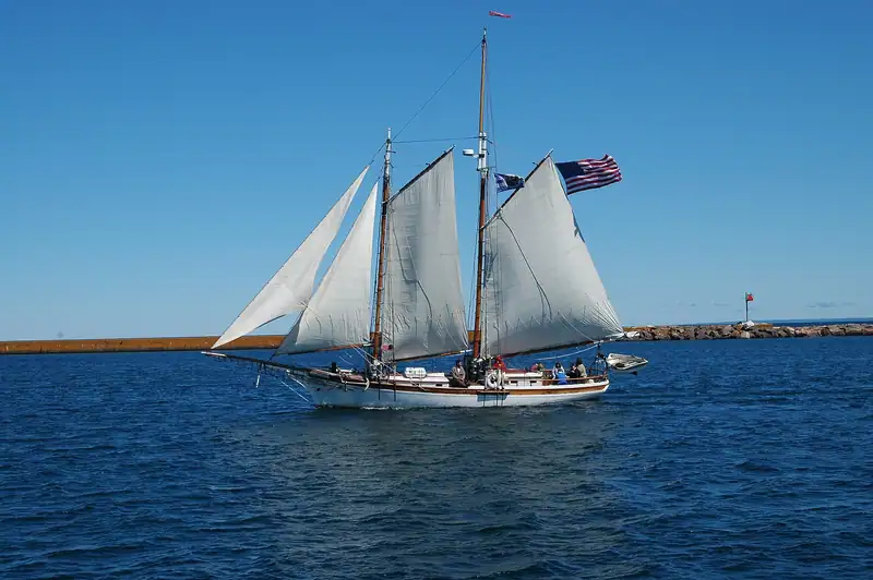 A sailing ship on deep blue Lake Superior water