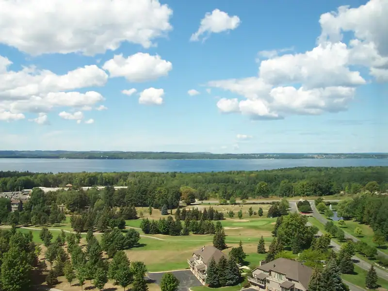 A view across green hills to the bay