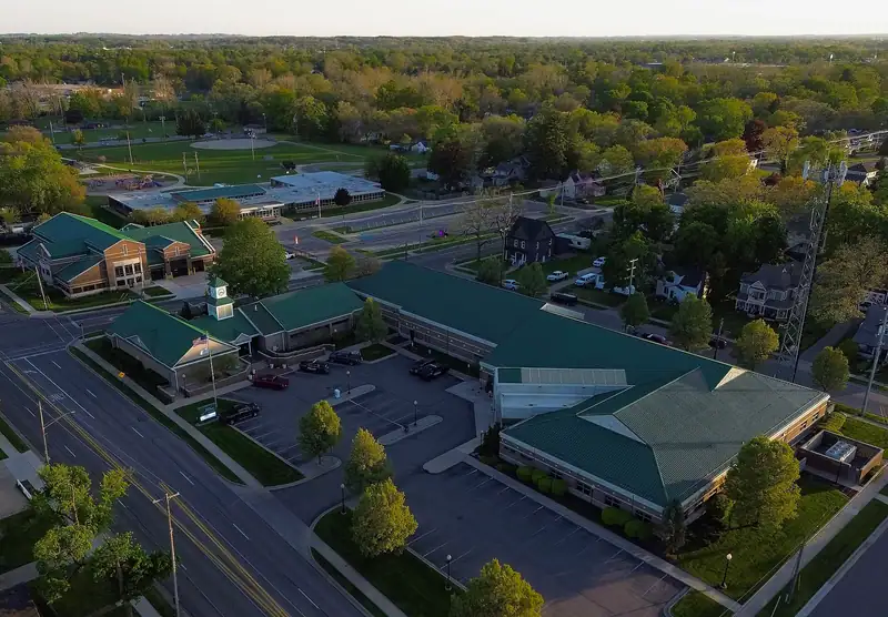 Aerial view of Grandville's city government center and nearby homes
