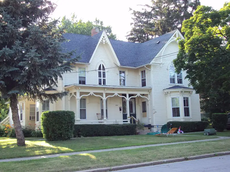 A white Victorian house with ornate trim