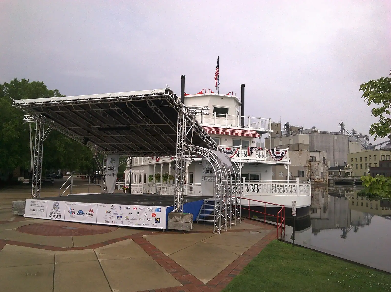A riverboat stage docked on the river downtown