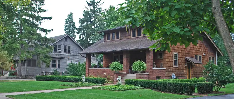 A tree-lined residential street of historic homes