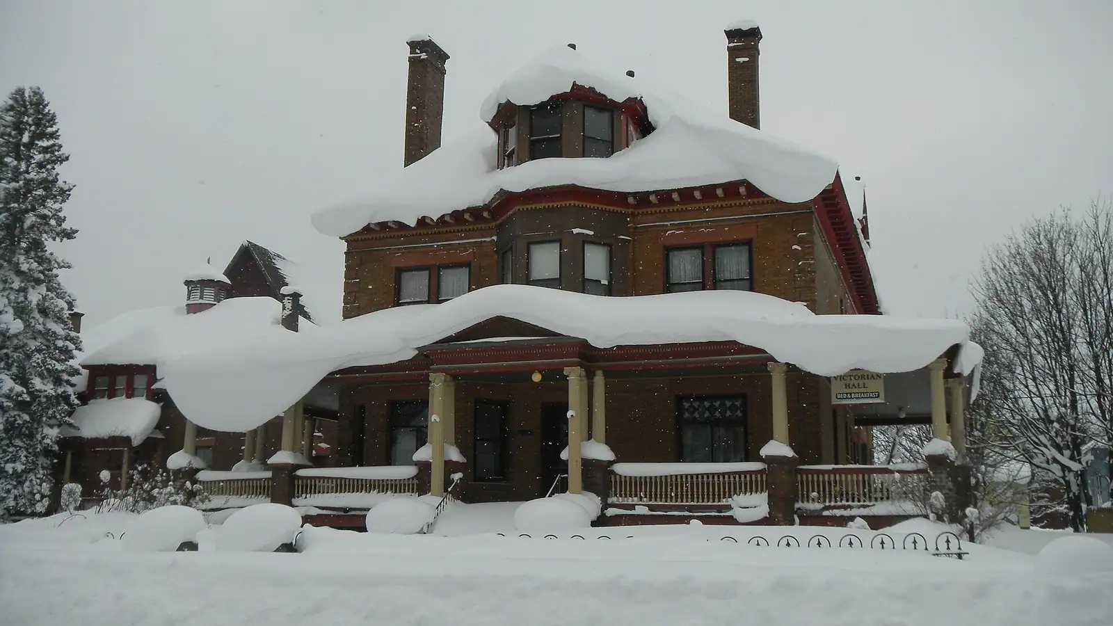 A large historic house in fresh snow