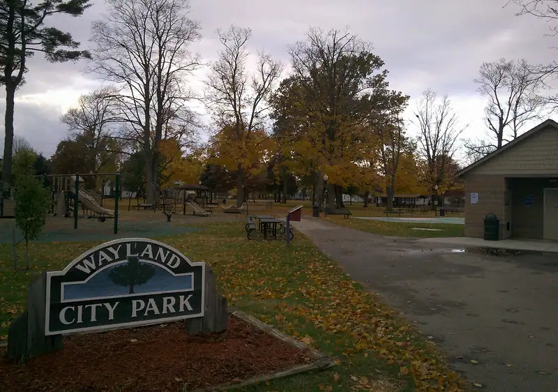 A small-town city park with fall trees