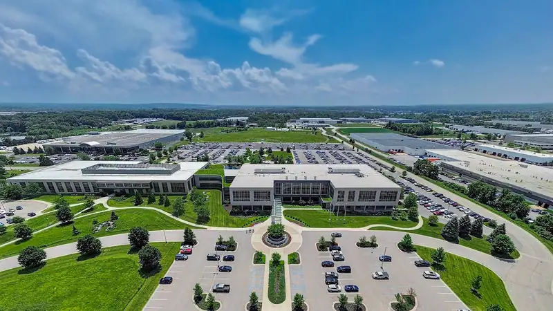Aerial view of a corporate campus surrounded by trees